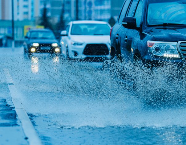 cars driving in the rain