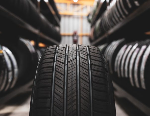 new tire is placed on the tire storage rack in the car workshop